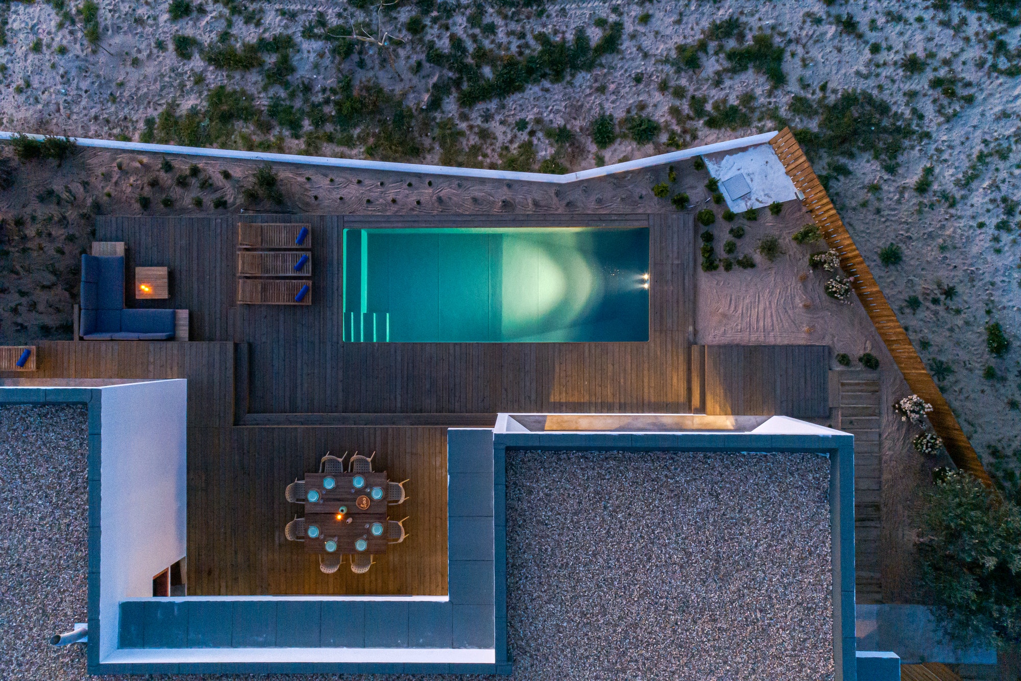 Aerial view of modern villa with pool and deck